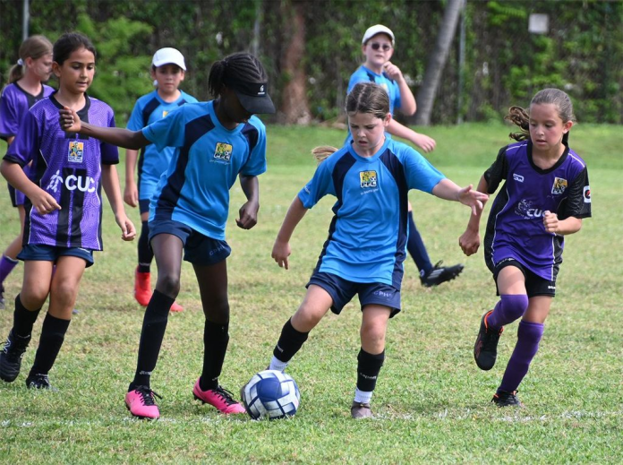 Action from the St Ignatius Catholic (purple) versus Cayman Prep GB girl’s game (Photo: Cayman Youth Football Leagues)