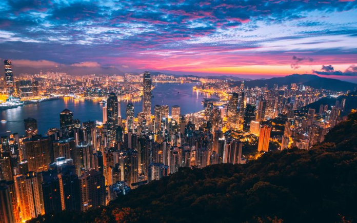 Hong Kong’s Victoria Harbour and Central, home to a stock exchange where 1,564 listed companies are Cayman-incorporated (Photo: Unsplash / Simon Zhu)